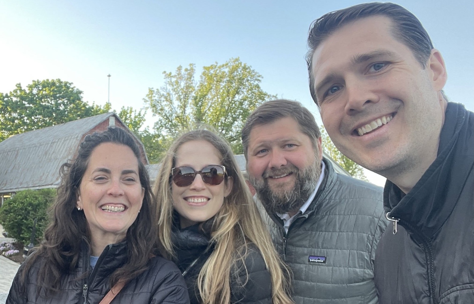 four alums outside tailgating