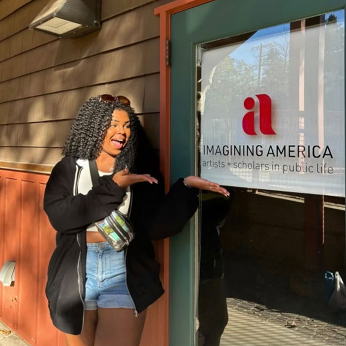Student in front of building
