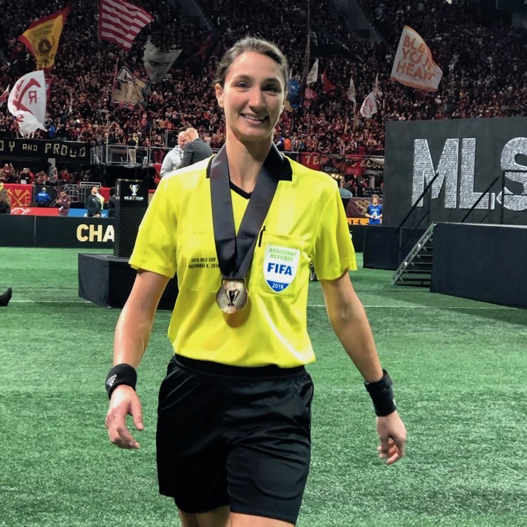 Referee and professor Kathryn Nesbitt on soccer field