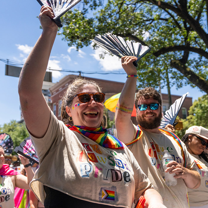 two alumni at pride parade