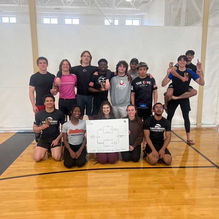 Lily Walton posing with the Towson University Brazilian Jiu Jitsu