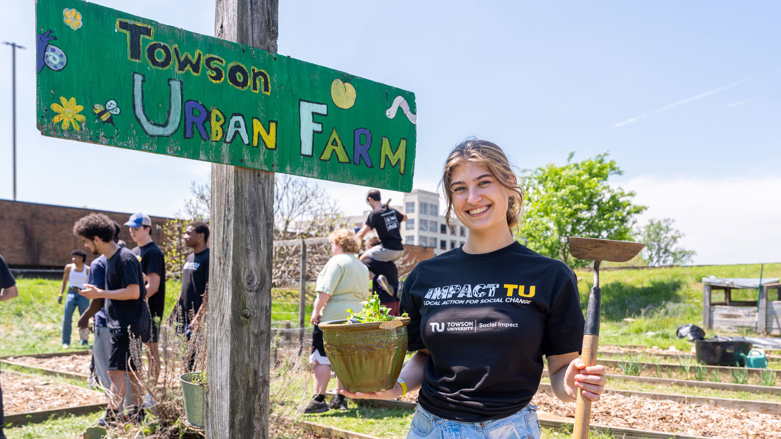 Lily Walton working at the Towson University Urban Farm