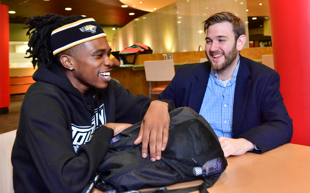 Matt Hicks sitting with John Highter