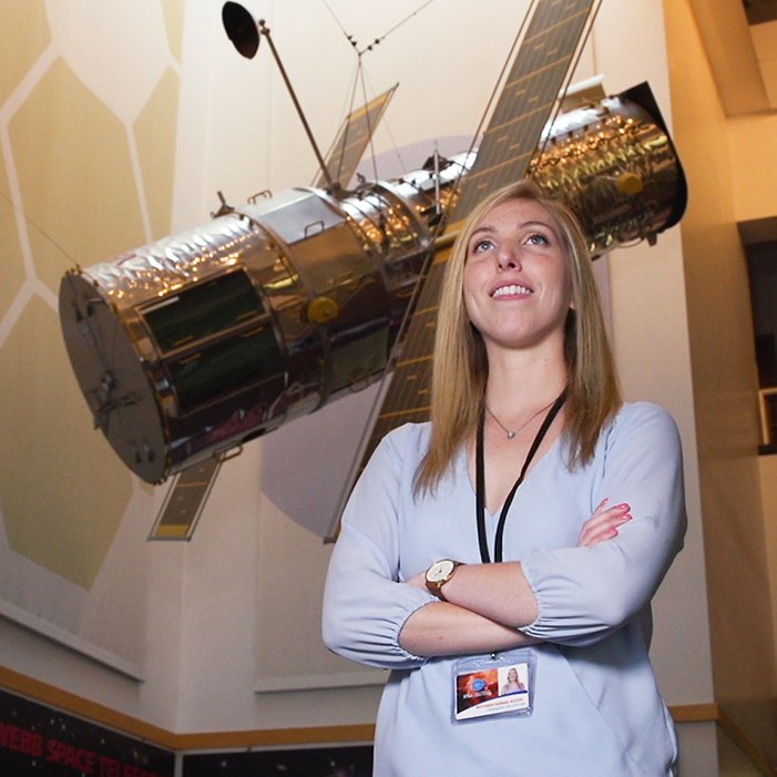 Meaghan McDonald with the Hubble Telescope model