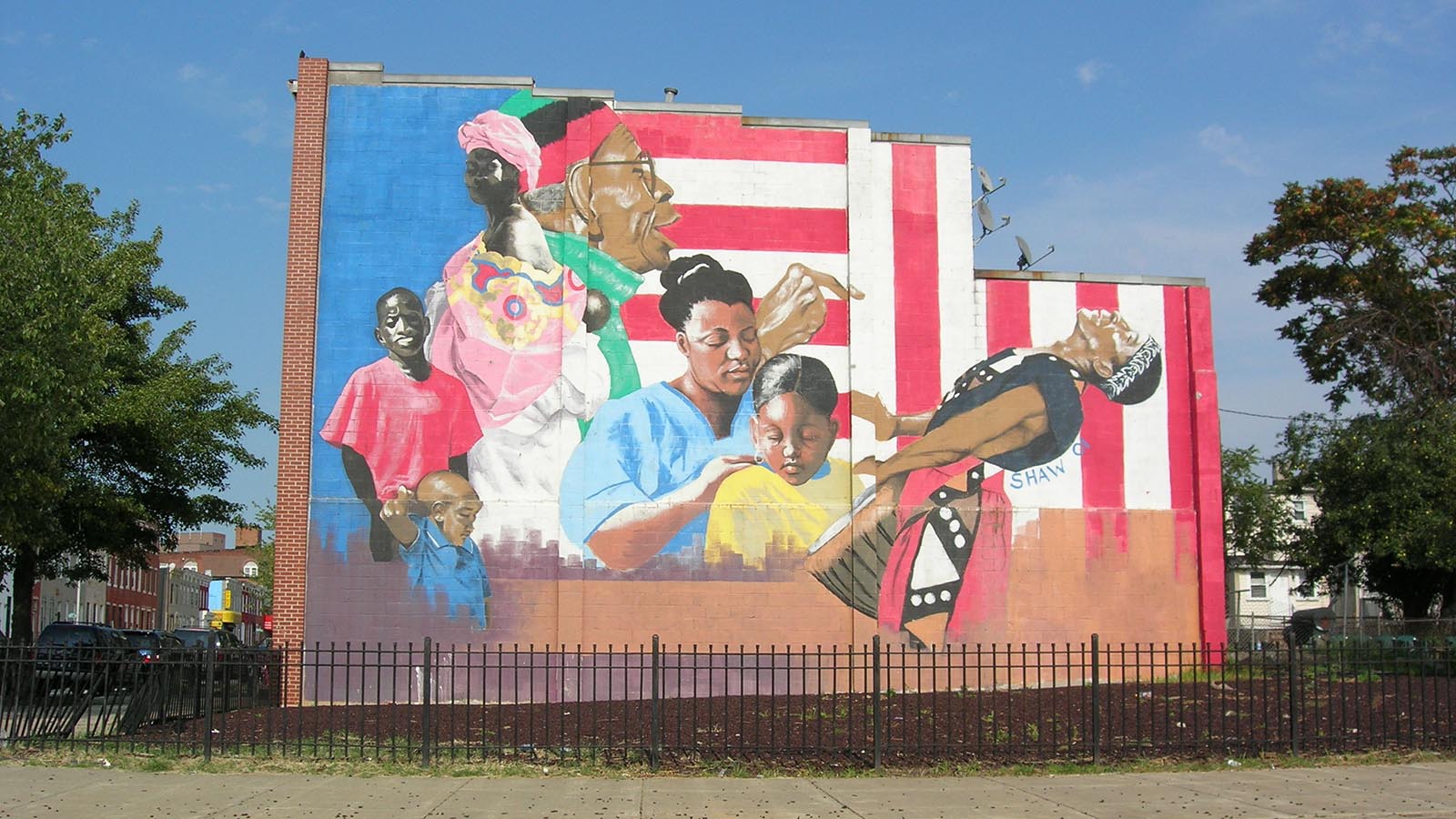 Baltimore City mural with young, middle aged and old Black people overlayed on top of red, white and blue stripes