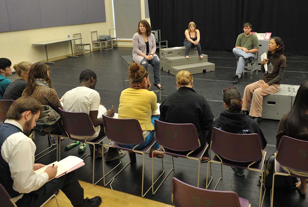Naoko Maeshiba, professor of theatre arts and director of TU's MFA in theatre arts, teaching a class. (pictured far right)