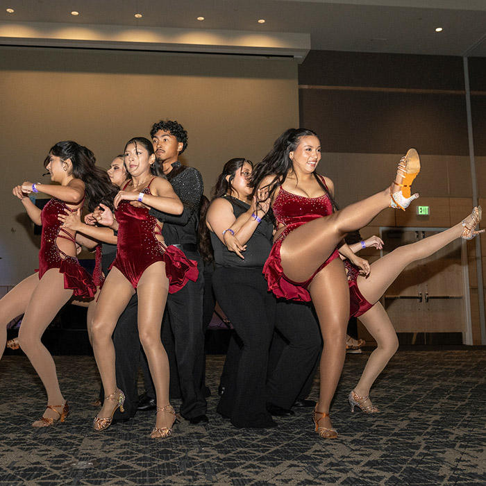 students dancing at noche event