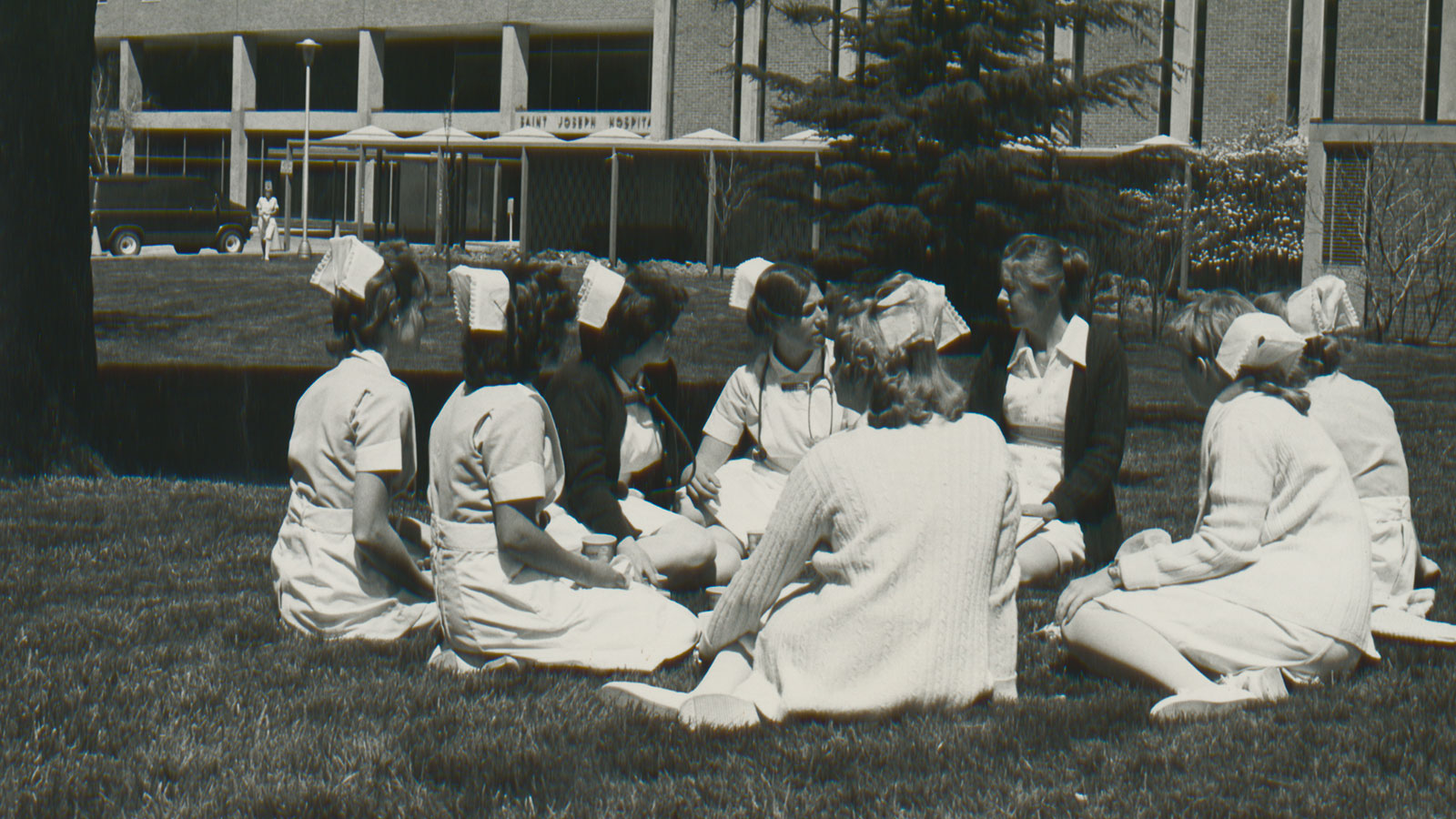 Nursing students sitting in front of St. Joseph's Hospital