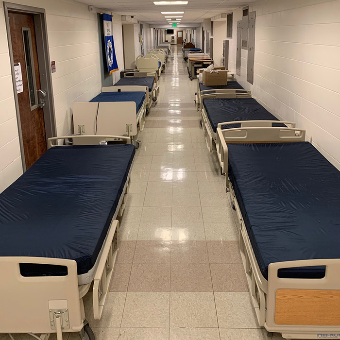 Hospital beds and tables in Linthicum Hall ready for donation.