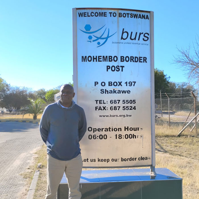 Professor Oduntan on-site in Botswana outside of the Botswana United Revenue Service