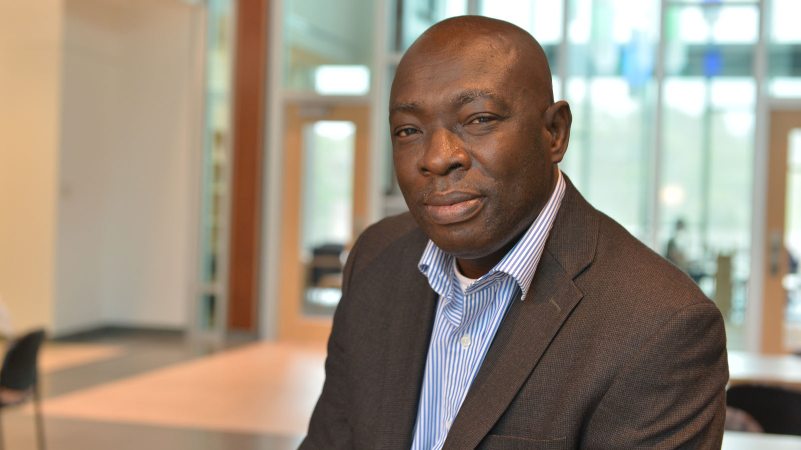 Portrait of Professor Oduntan in the College of Liberal Arts on TU's campus