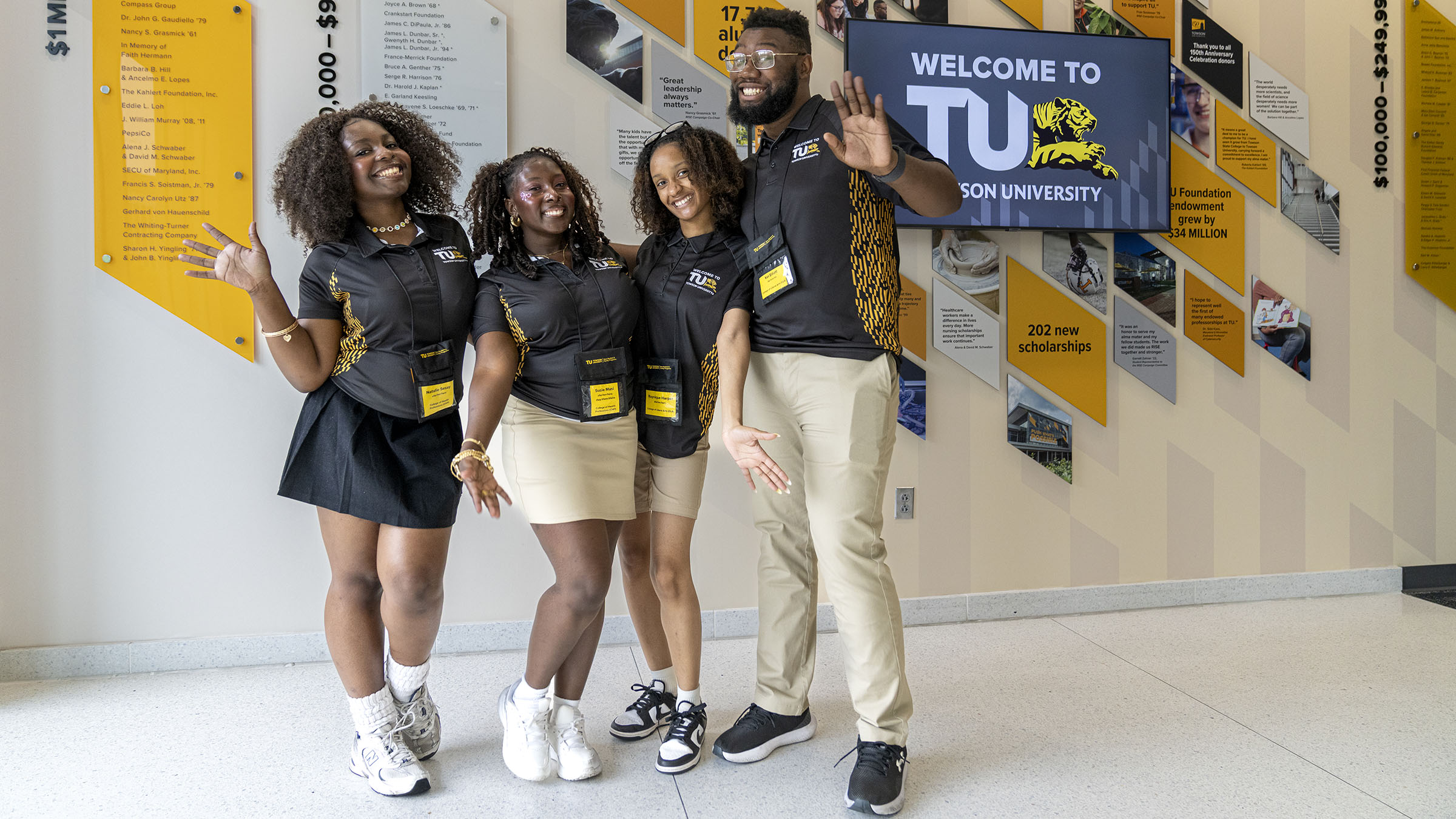 Four TU Orientation Leaders pose for a photo.