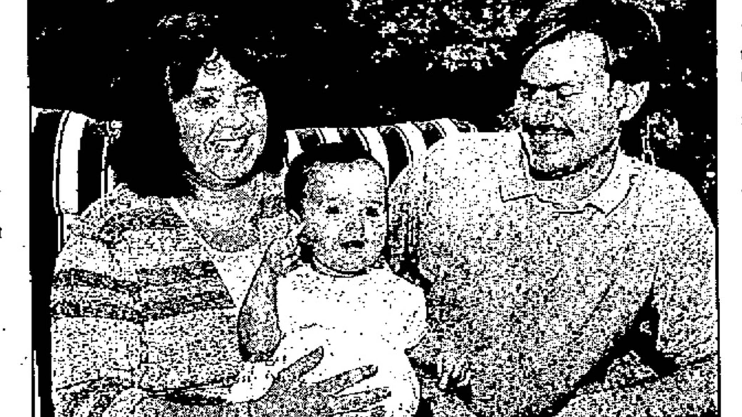 Paige Detwiler as a one-year-old with their parents