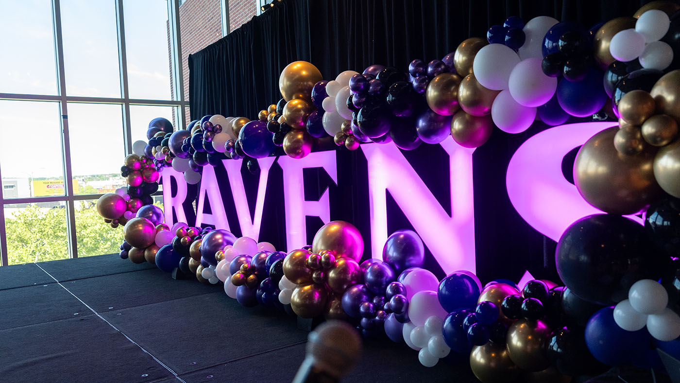 The word Ravens lit up with lights and balloons