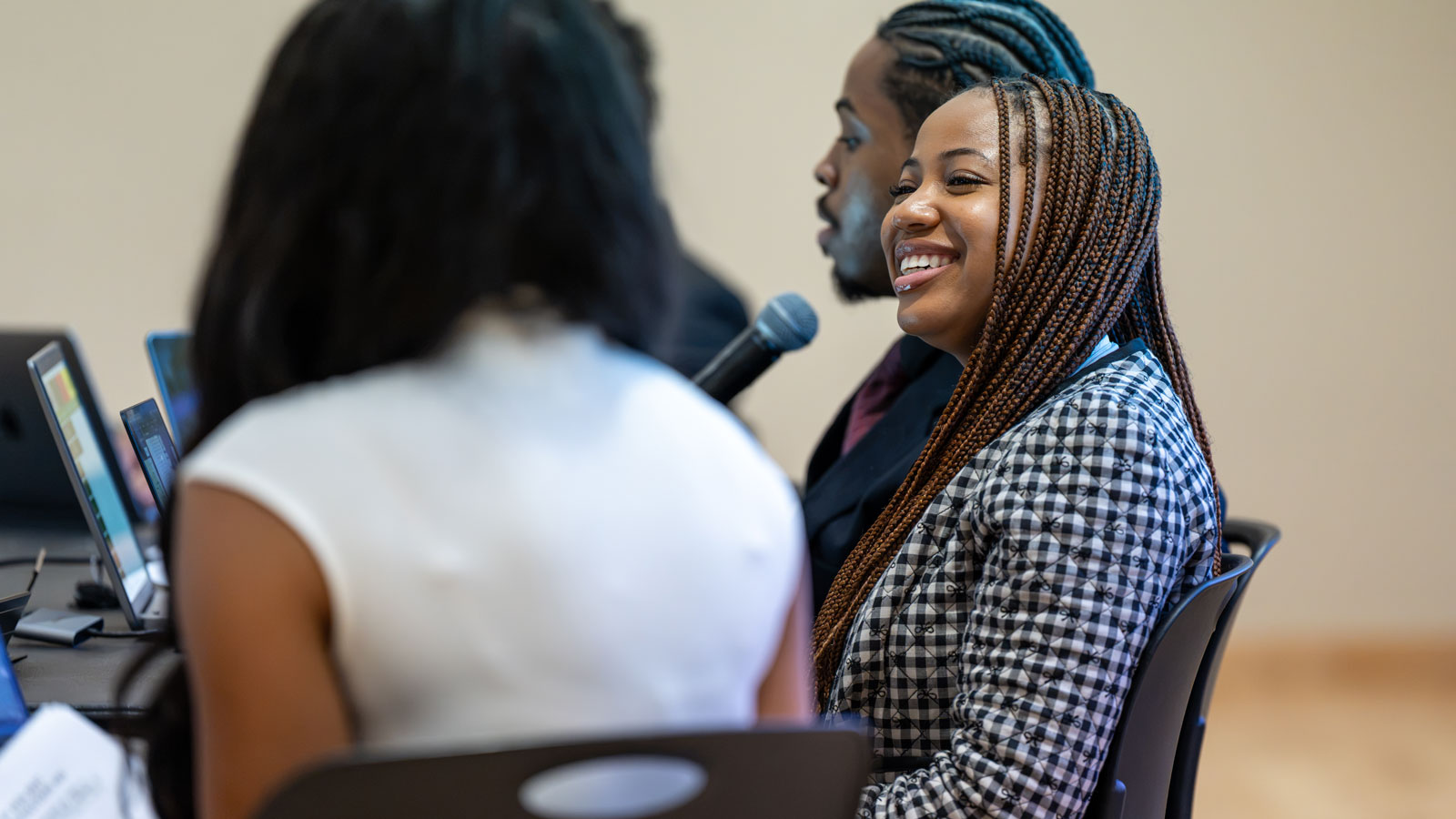 President Rayne Rivera-Forbes looking over a SGA General Assembly Meeting