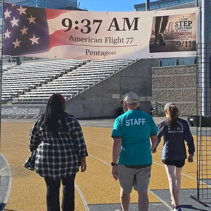 Participants in the Remembrance Walk begin the walk at 9:37 AM