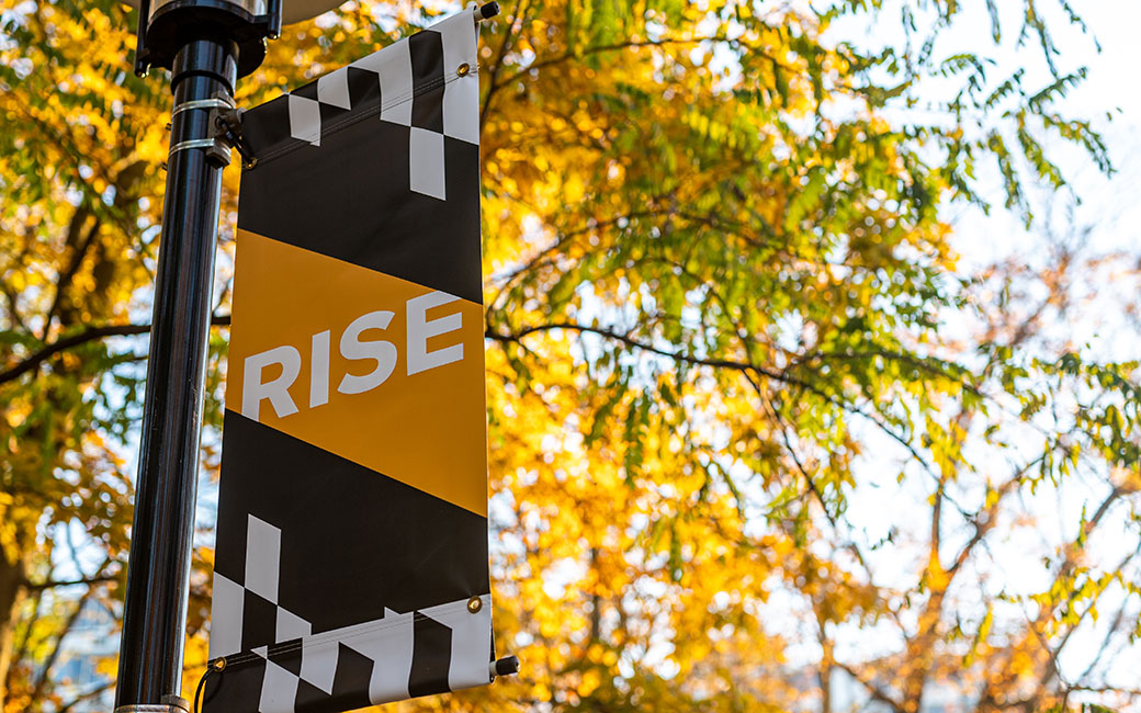 Rise Campaign flag on Towson University's campus