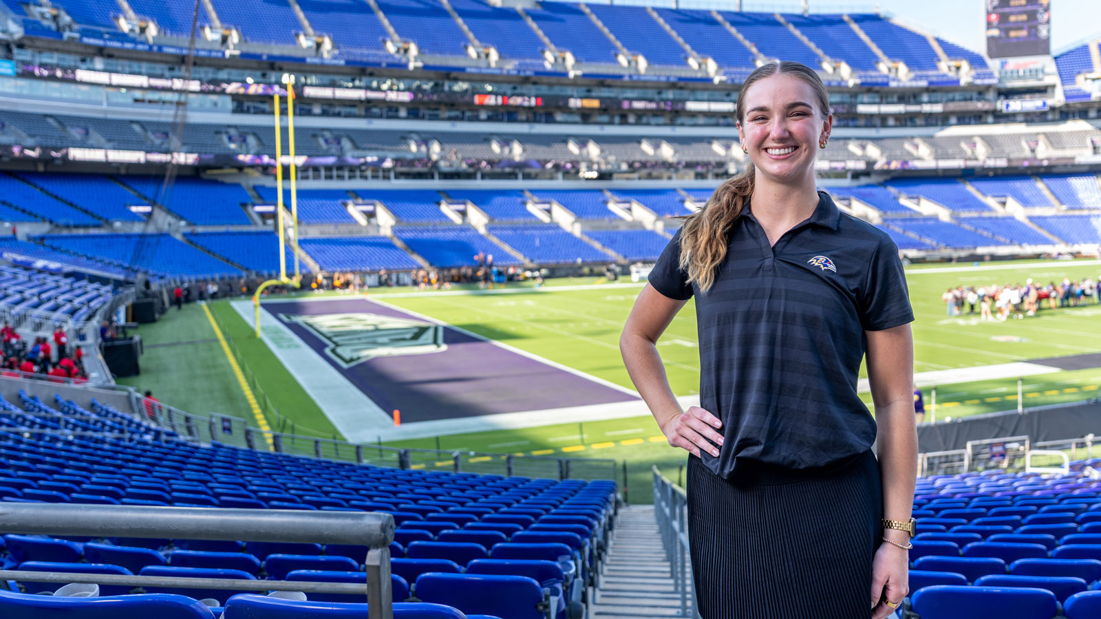 Sara ParksVold posing inside M&T Bank Stadium 