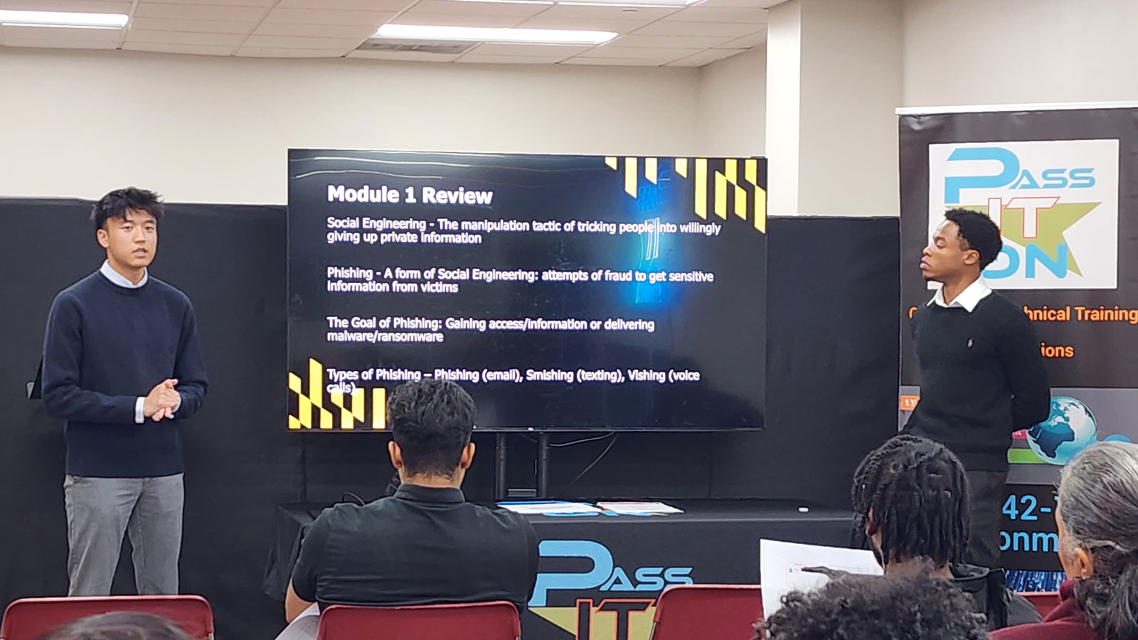 Two members of the Sec Ops Research Team deliver an anti-phishing attack training