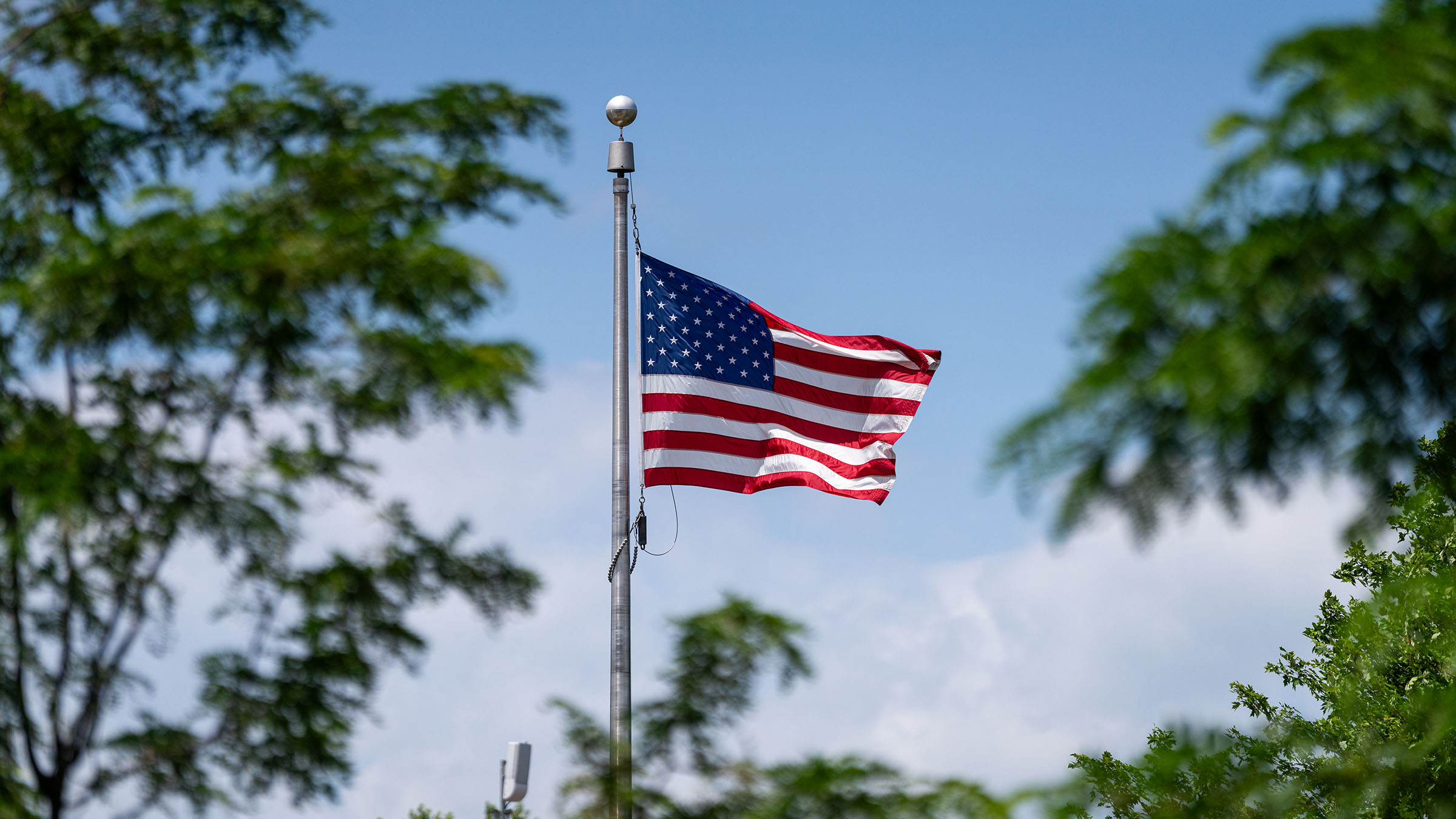 An American flag flies at half staff. 