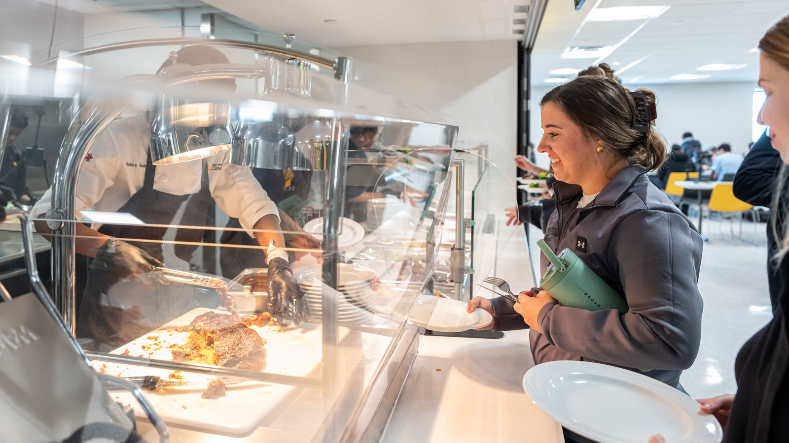 A TU Athletics Staff Member Gets Brisket from Doc's South Campus Kitchen