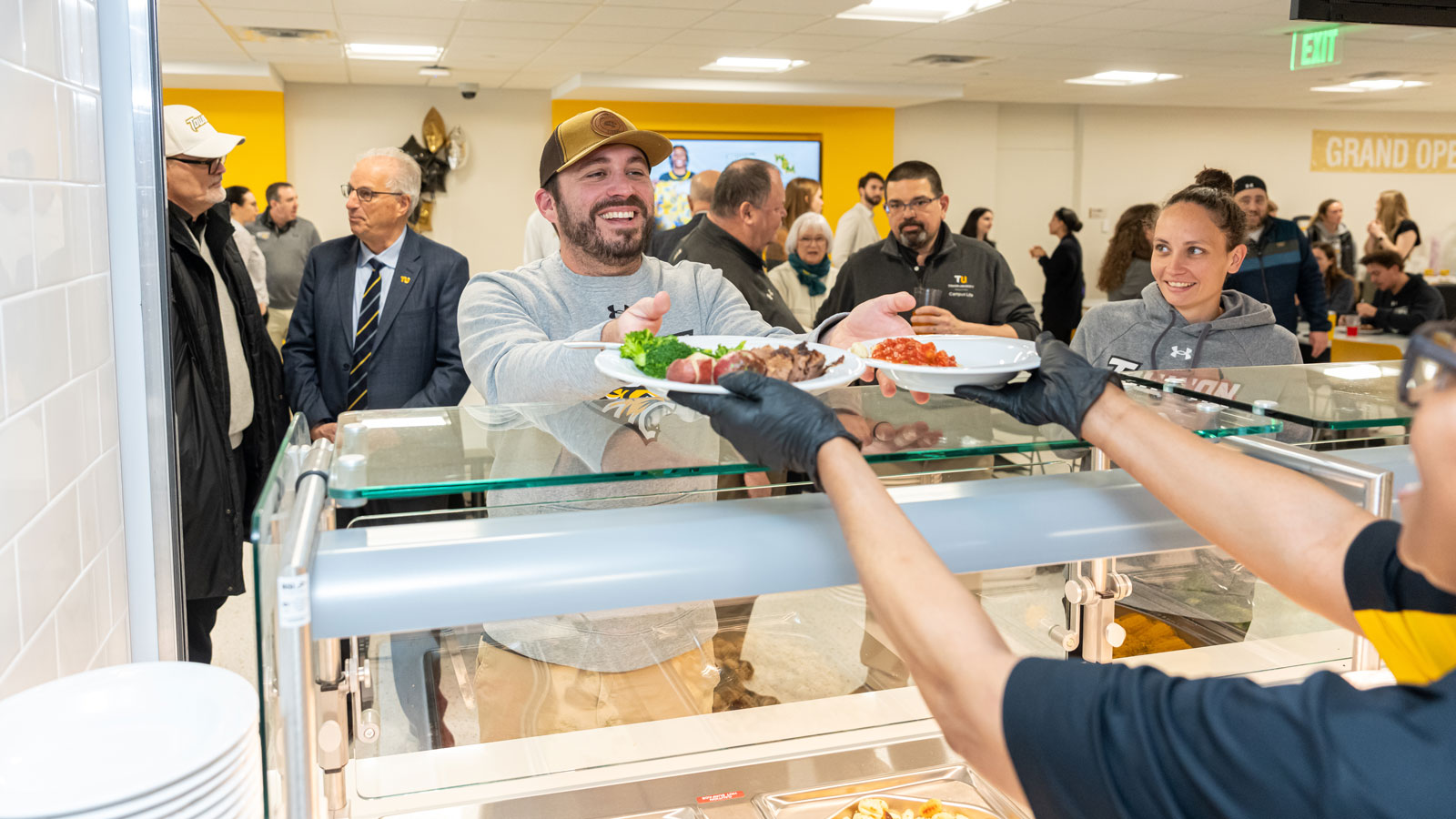 a diner receiving a meal at doc's south campus grille