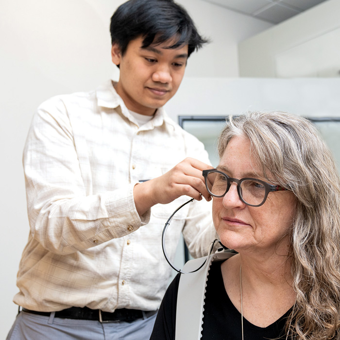 woman getting fitted for a hearing aid