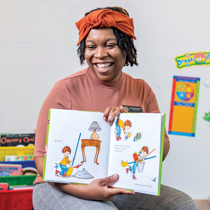 Woman reading a children's book out loud