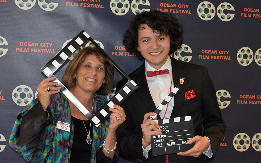 People holding film props in press photo