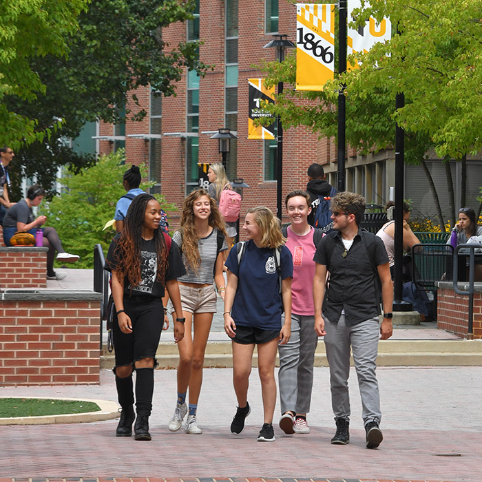 Students walk across campus