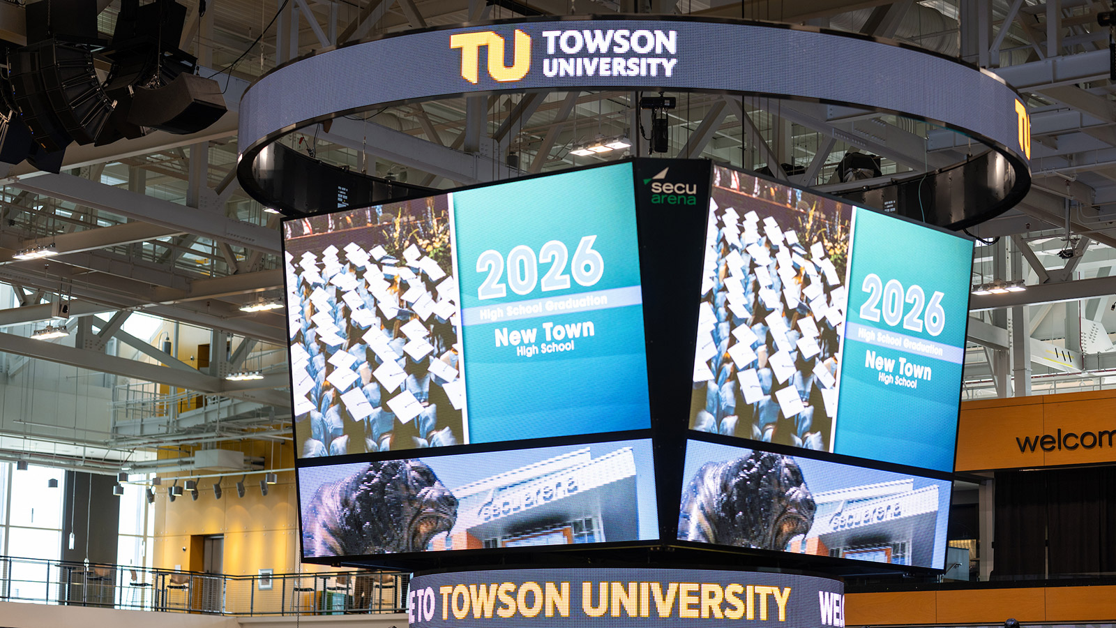 the secu arena screenboard welcoming guests to a high school graduation