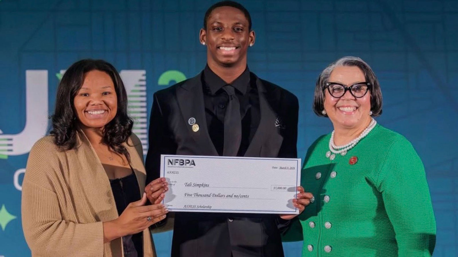 Junior Tali Simpkins winning one of his many scholarships during his time at TU. 