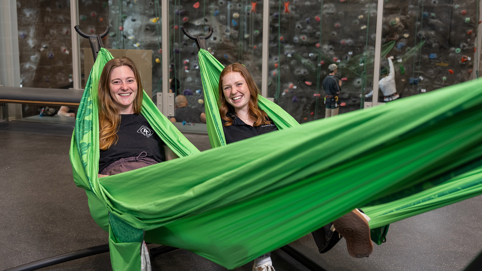 two towson university students laying in hammocks