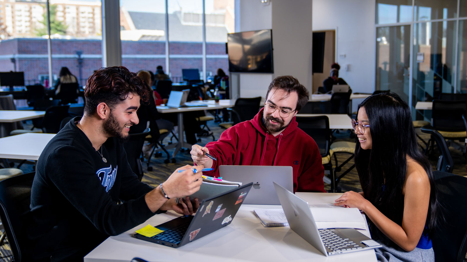 Students in the academic commons participate in a group study session