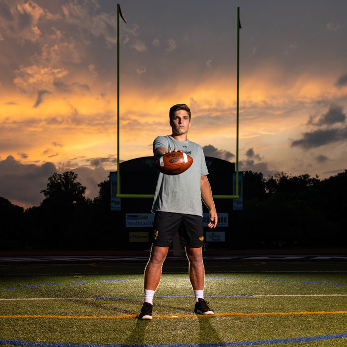 Tom Flacco on the field at sunset