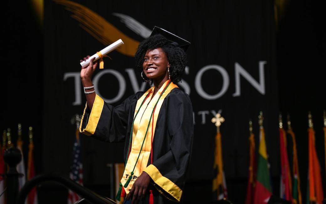TU graduate on Commencement stage