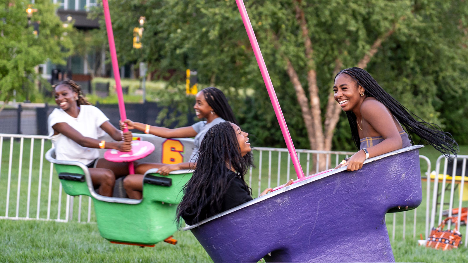 Students having fun on the Mind Winder fair ride at TU Takeover