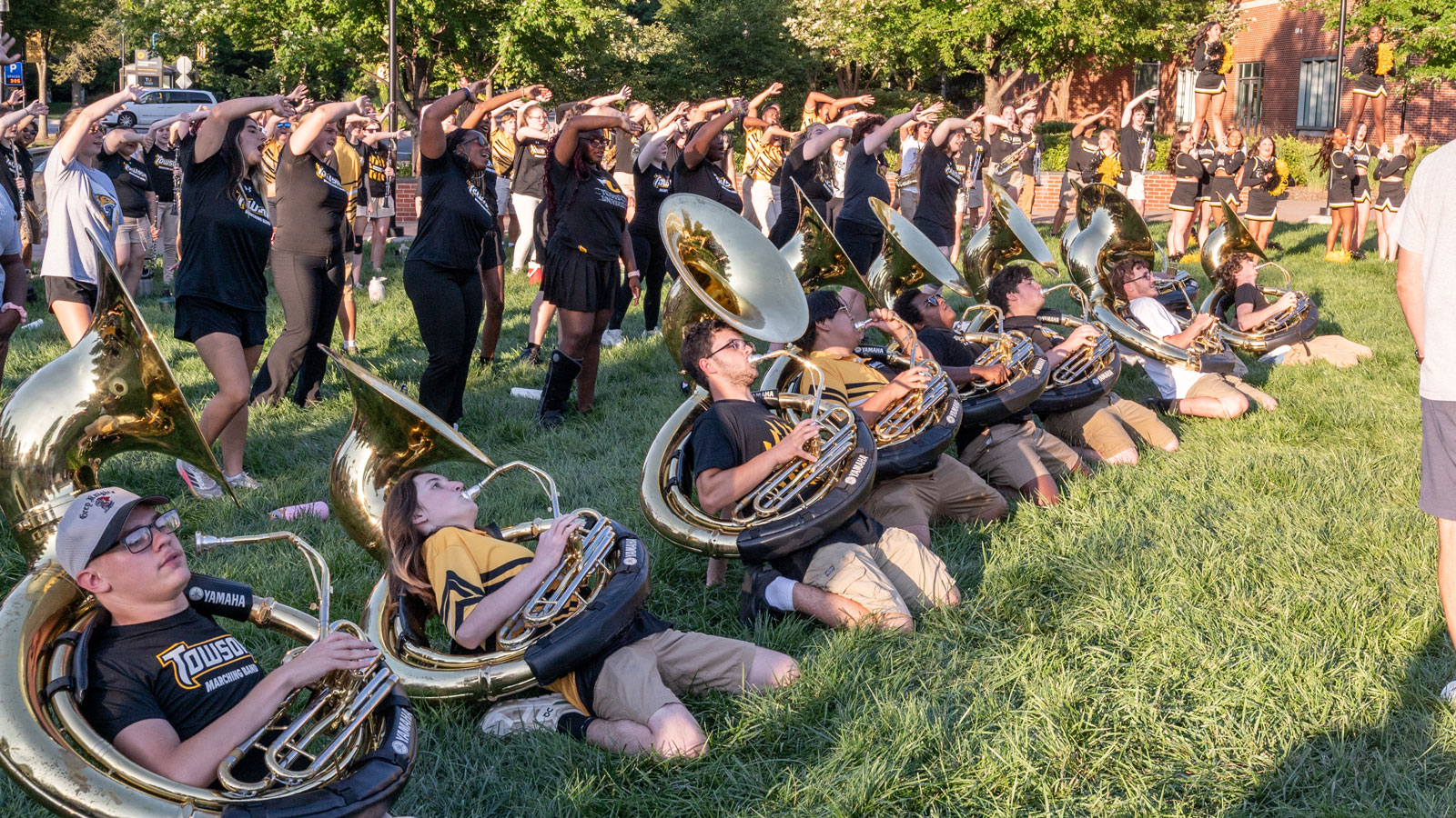 A picture of the Towson University Marching Band going to the ground while playing the theme song to the ESPN highlight show Sportscenter