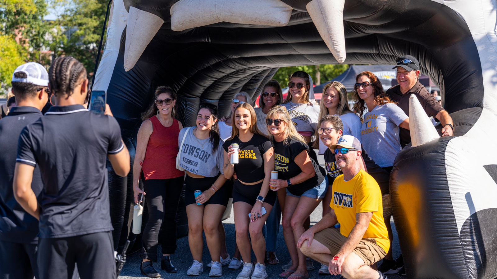 A picture of families posing together during the most latest iteration of Towson University Family Weekend