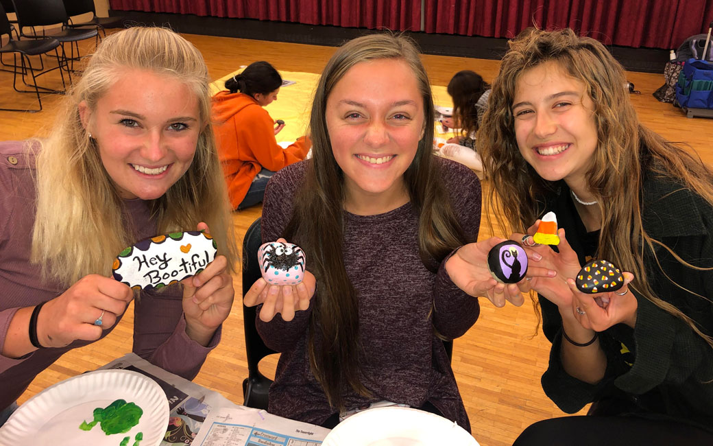 Students of the Towson Rocks Club show off thier painted rocks