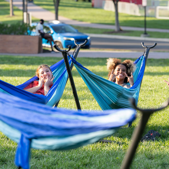 New students relaxing in hammocks