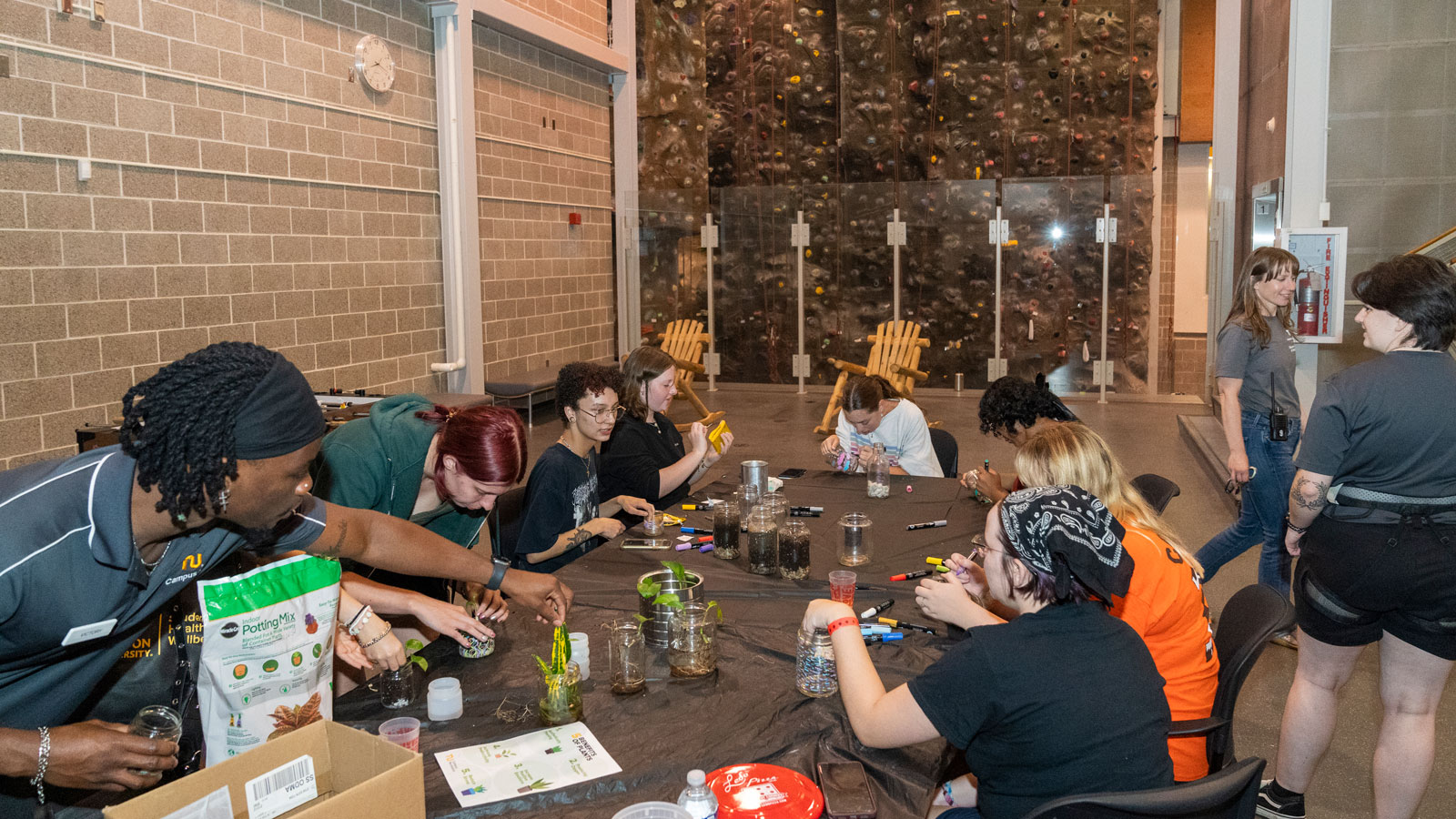 Students potting mini plants at TU Takeover event