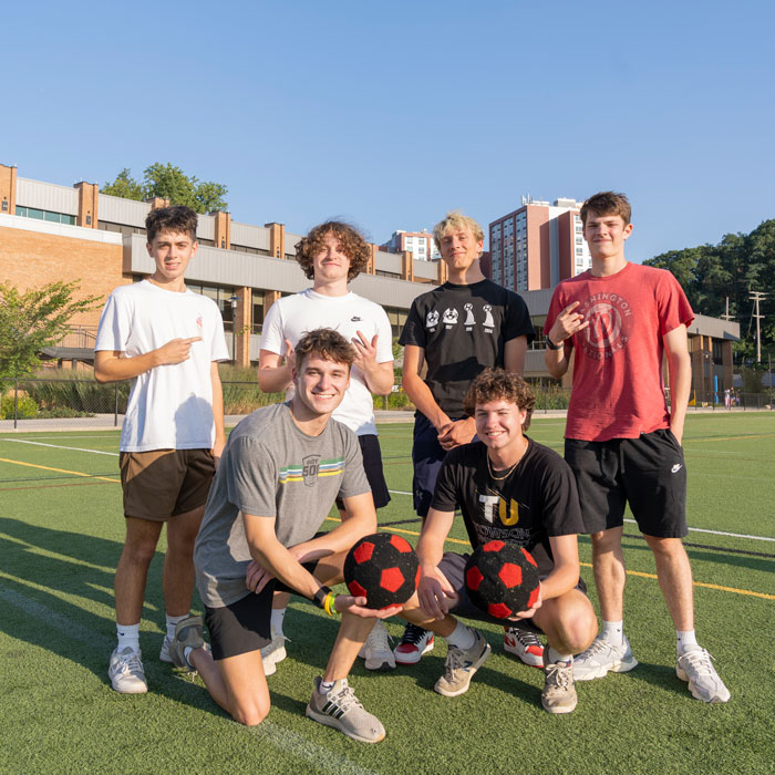 New students play a friendly game of soccer