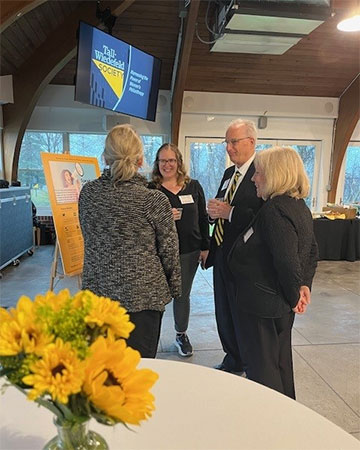 President Ginsberg socializing with event participants