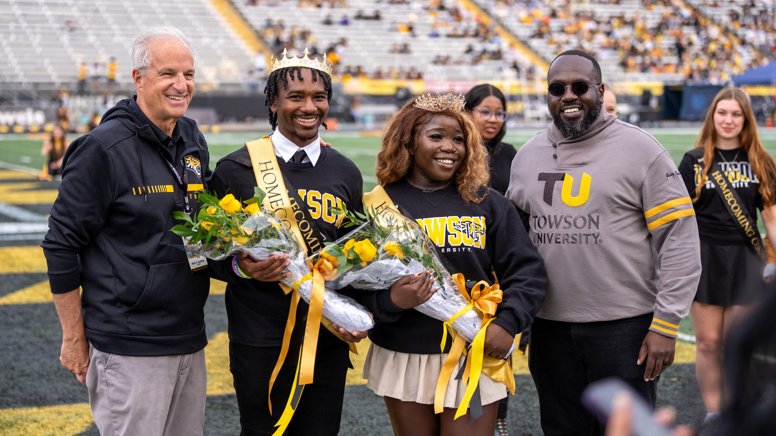 Last year's homecoming king and queen pose with Dr. Ginsberg and Dr. Hurte 