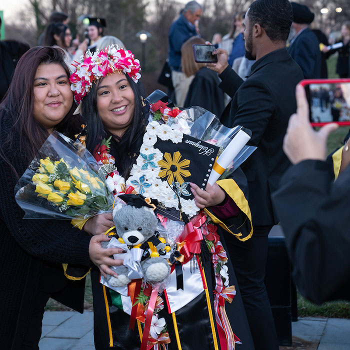 Graduate with flowers