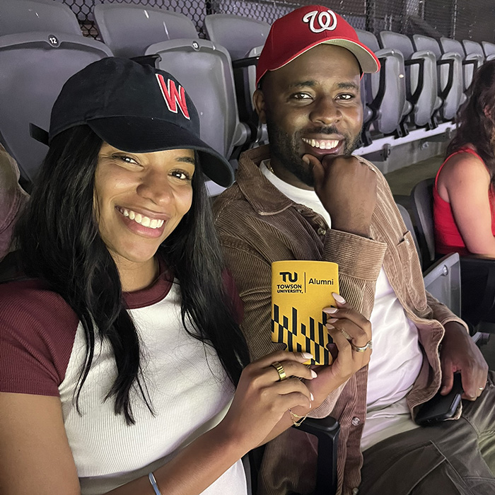 Mia Edwards ’16 and Derrick Edwards ’16 watch the D.C. United match.