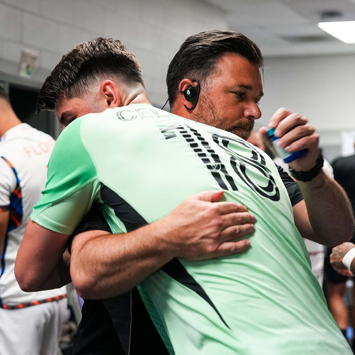 Patrick Tanner hugging a soccer player