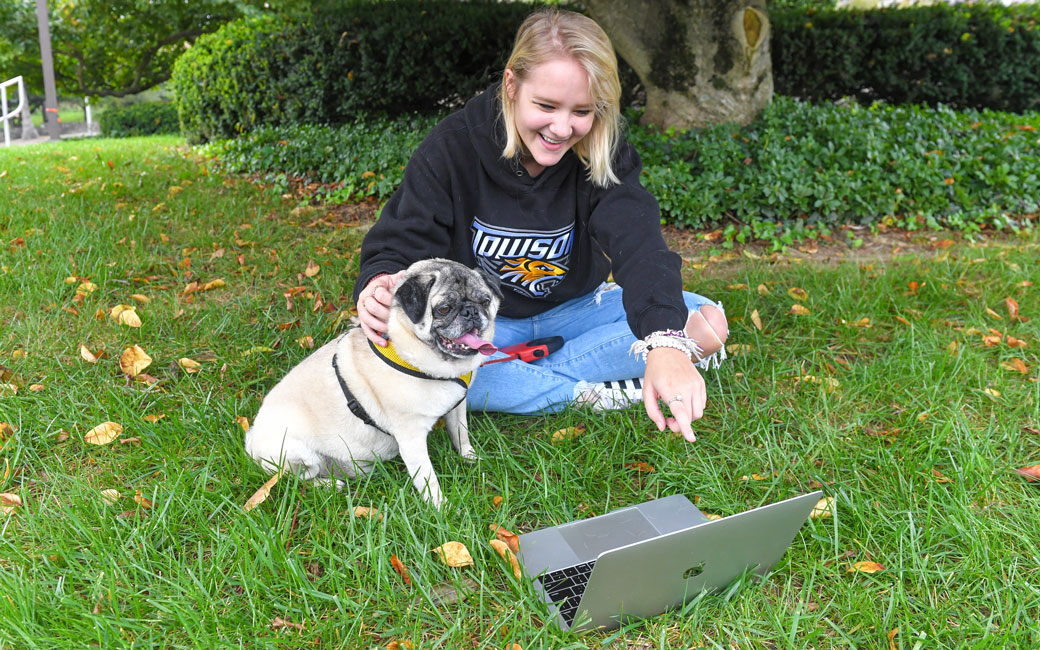 A TU Student and her Pug enjoy Yappy Hour