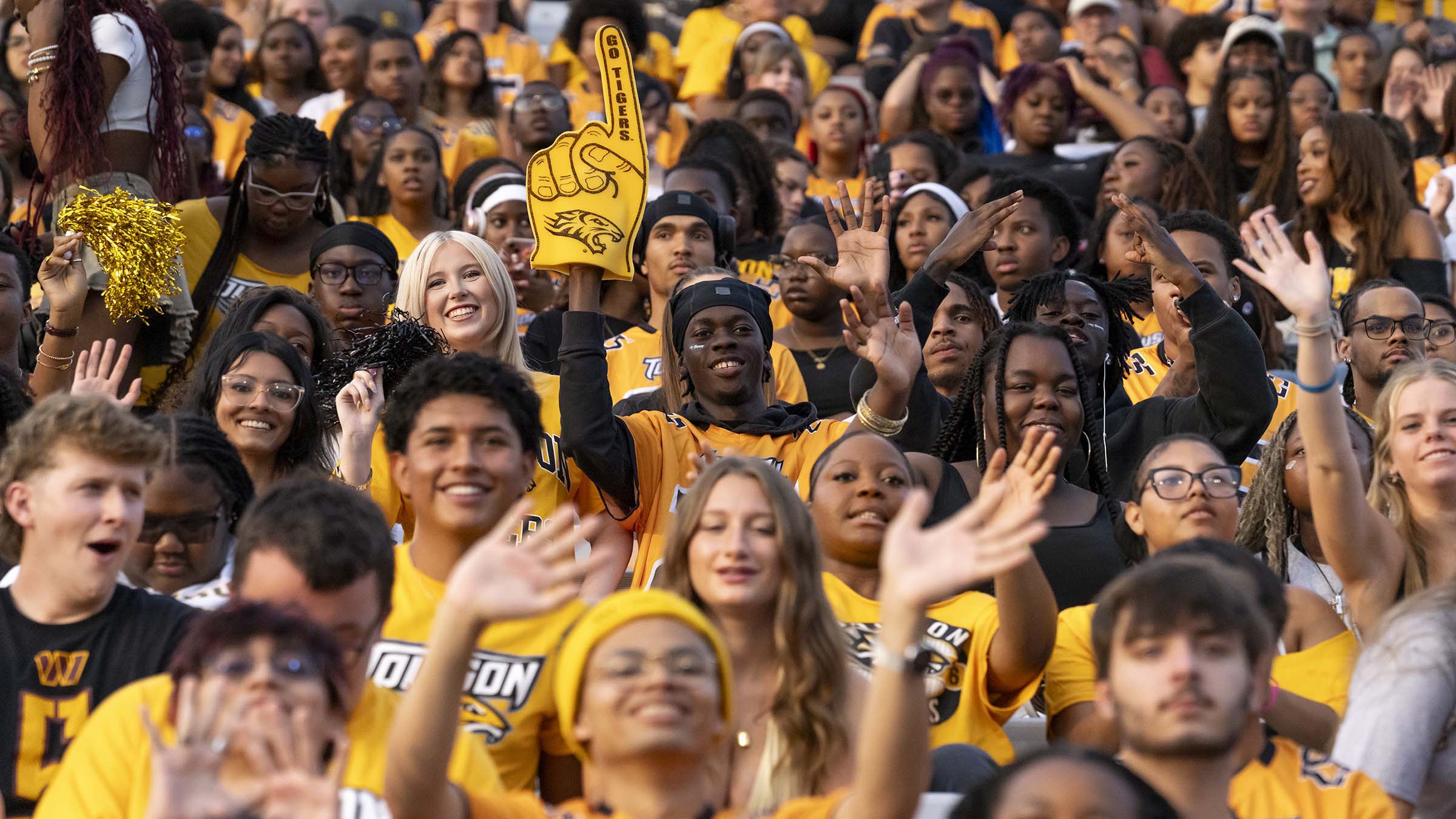 crowd of tu students in gold gear